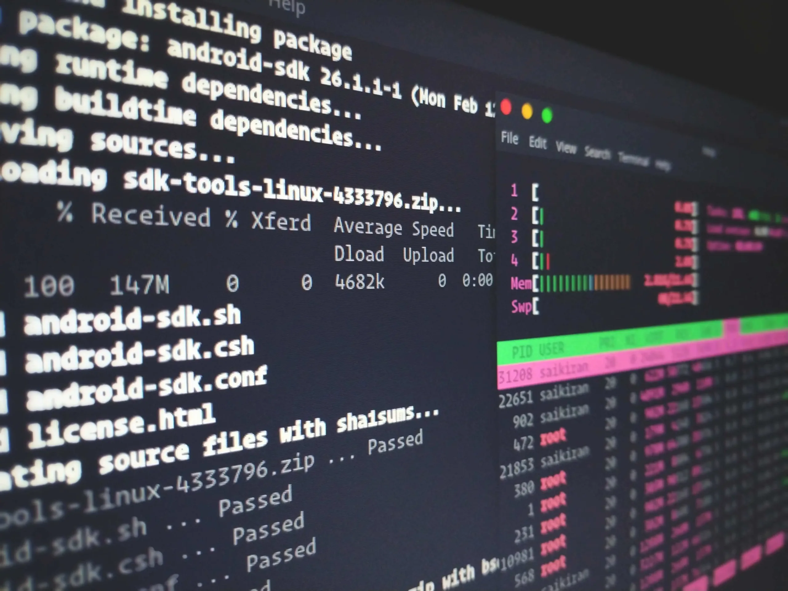Close-up of terminal window showing Android SDK package installation process with progress bars and system monitoring metrics