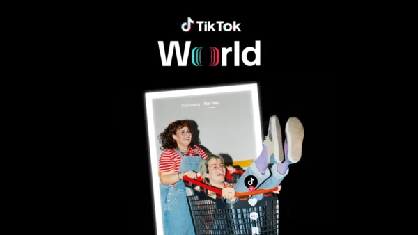 TikTok World image of grinning woman pushing a laughing guy in a shopping cart