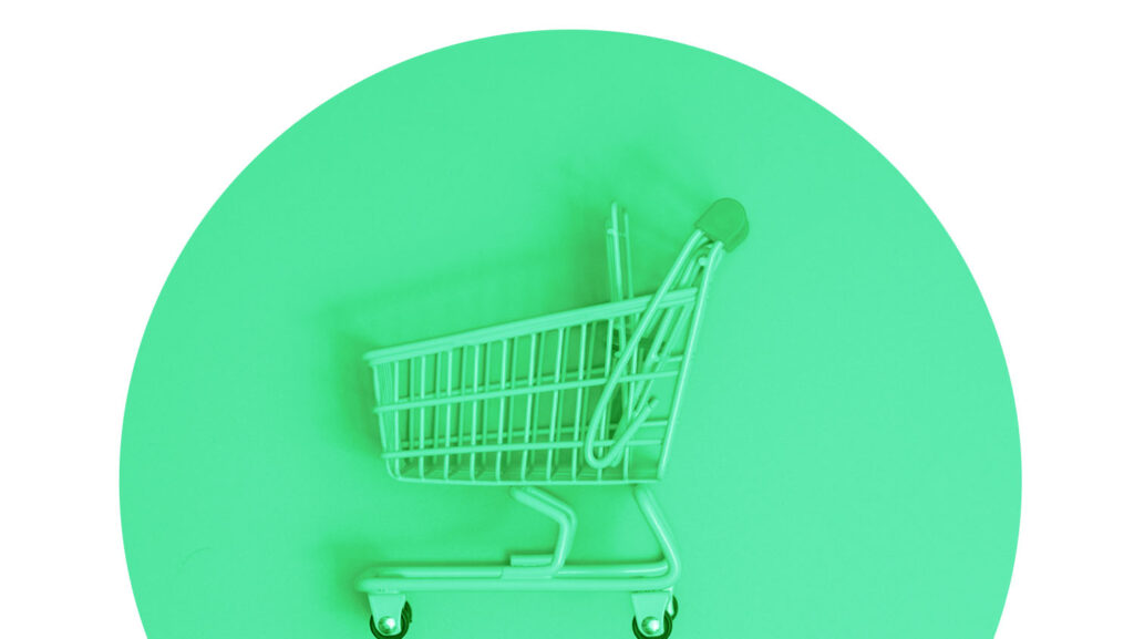 Shopping cart spotlighted in green