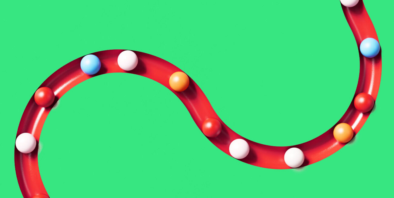 Colorful spheres rolling throw a snaking track