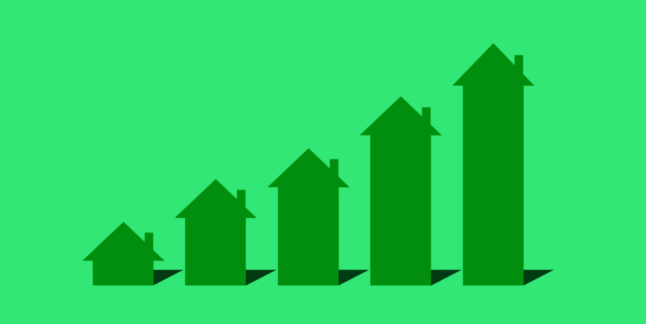 A rising bar graph made of house symbols