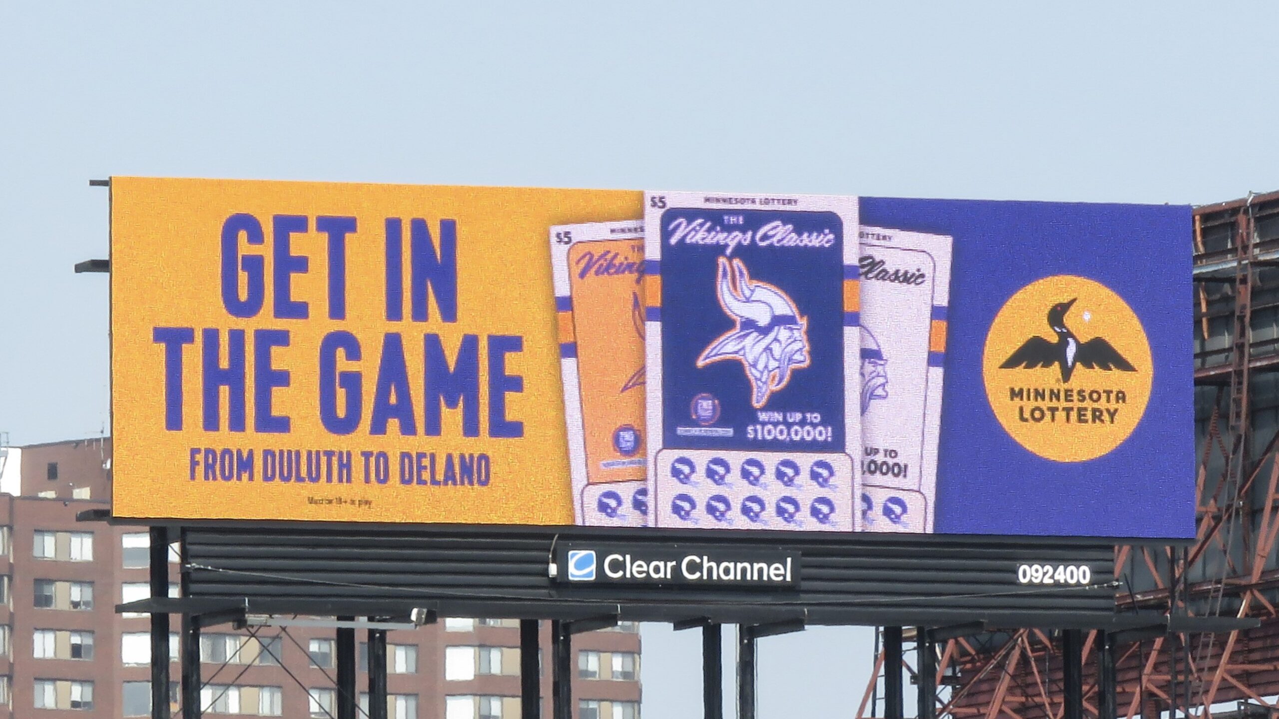 A Billboard showcasing a collaboration between the Minnesota Vikings and the Minnesota State Lottery A Billboard showcasing a collaboration between the Minnesota Vikings and the Minnesota State Lottery. The text reads: "Get in the Game"