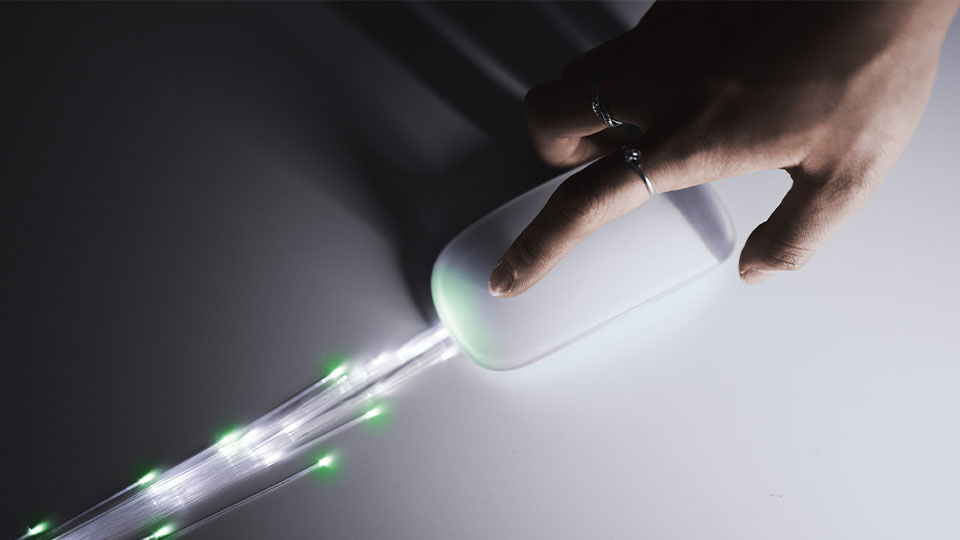 Clicking a mouse with a light trail following each stroke.