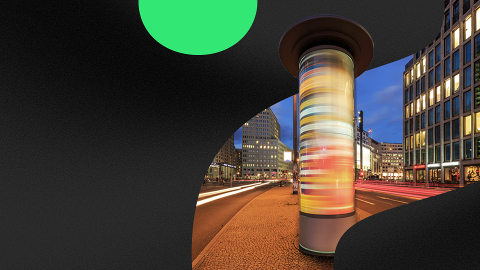 A long-exposure photo of a media billboard.