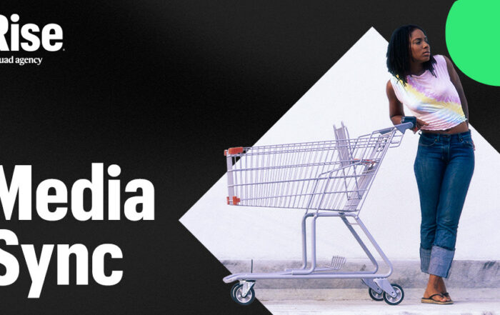 A woman pushing a shopping cart. Text reads: Media Sync