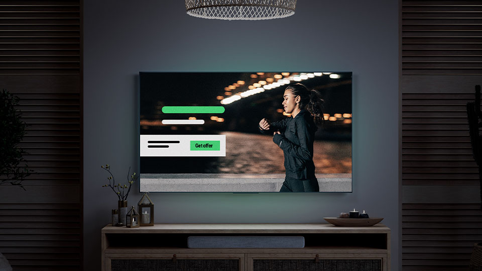 A tv screen showing an ad. Text reads: “Get Offer” A tv screen showing an ad. Text reads: "Get Offer"