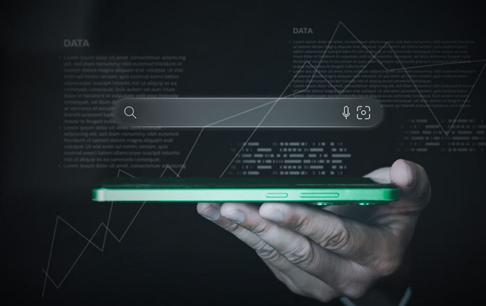 A search bar in dark mode hovering over a green cell phone being held in a person's hands. Data and information are spread throughout the image.