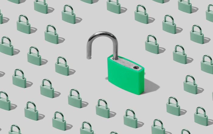 An unlocked green lock surrounded by a large group of smaller locked locks