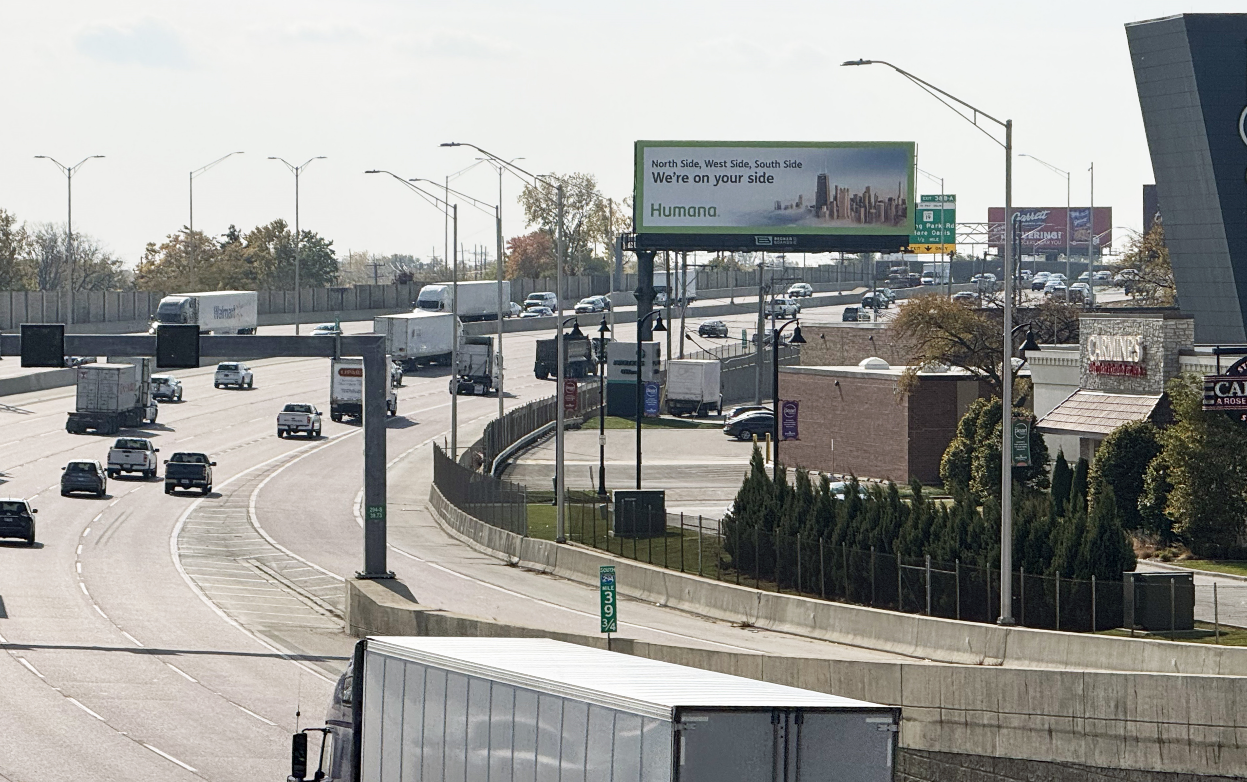 A Humana billboard above the expressway in Chicago