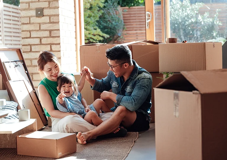 A family spending time together while unpacking boxes